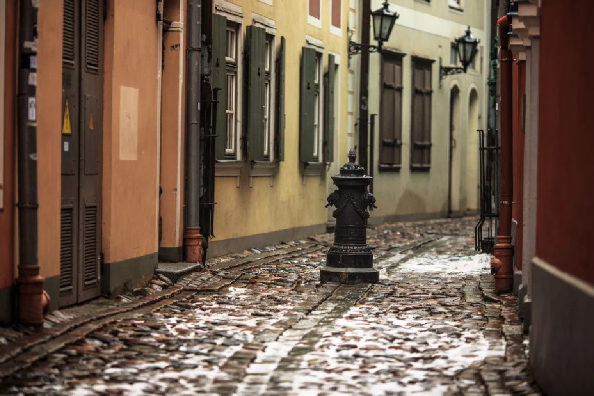 Charming cobblestone alley in a European city during a winter day.
