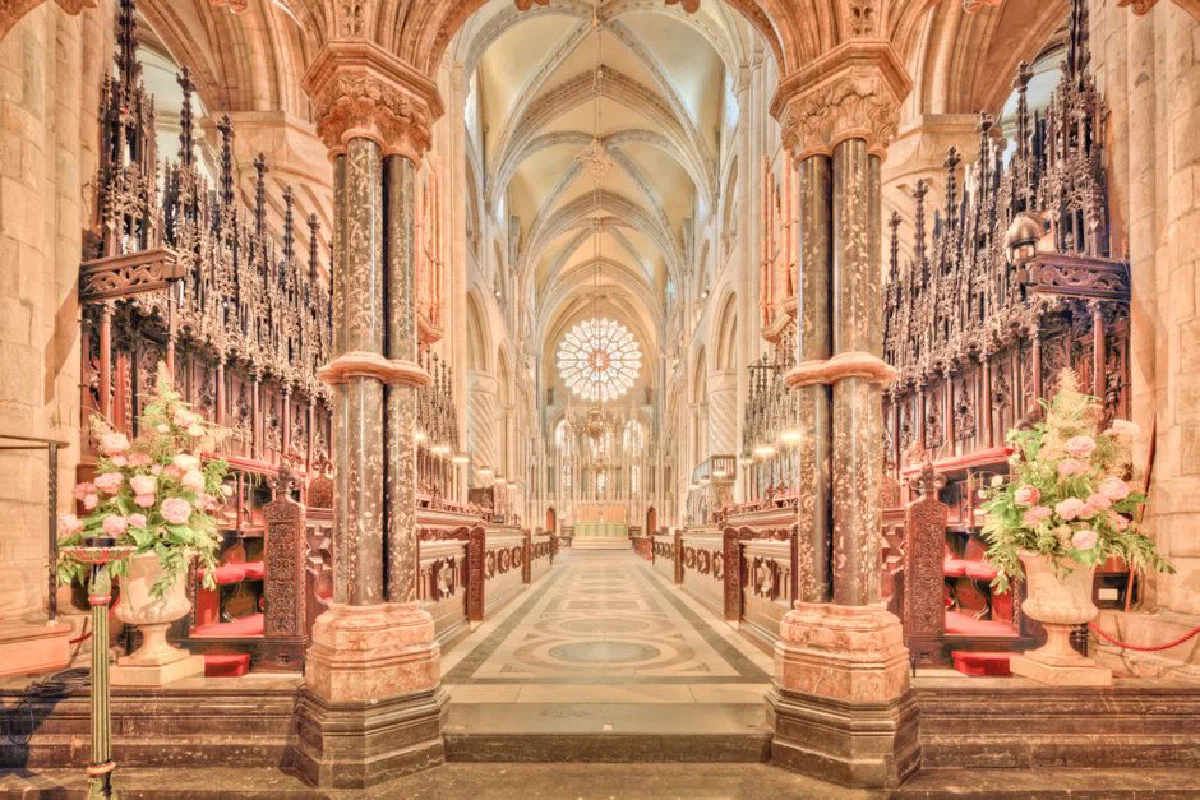 Captivating view of the historic Durham Cathedral's nave with Gothic arches and ornate choir stalls.