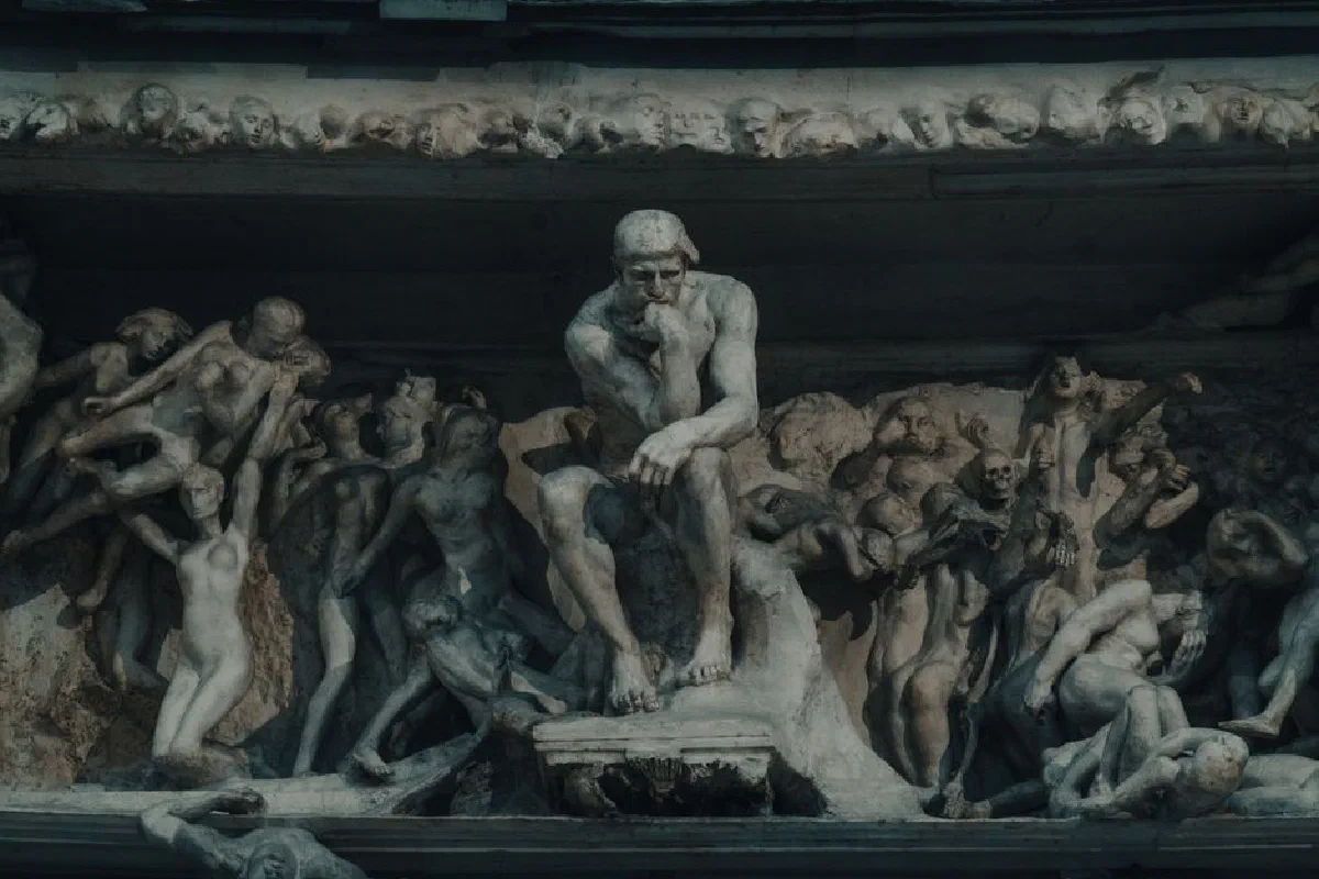 Detailed stone sculpture showing mythical and classical figures in intricate relief.