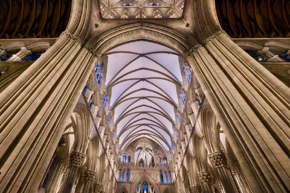 Majestic view of the intricate Gothic arches in Nidaros Cathedral, Trondheim.