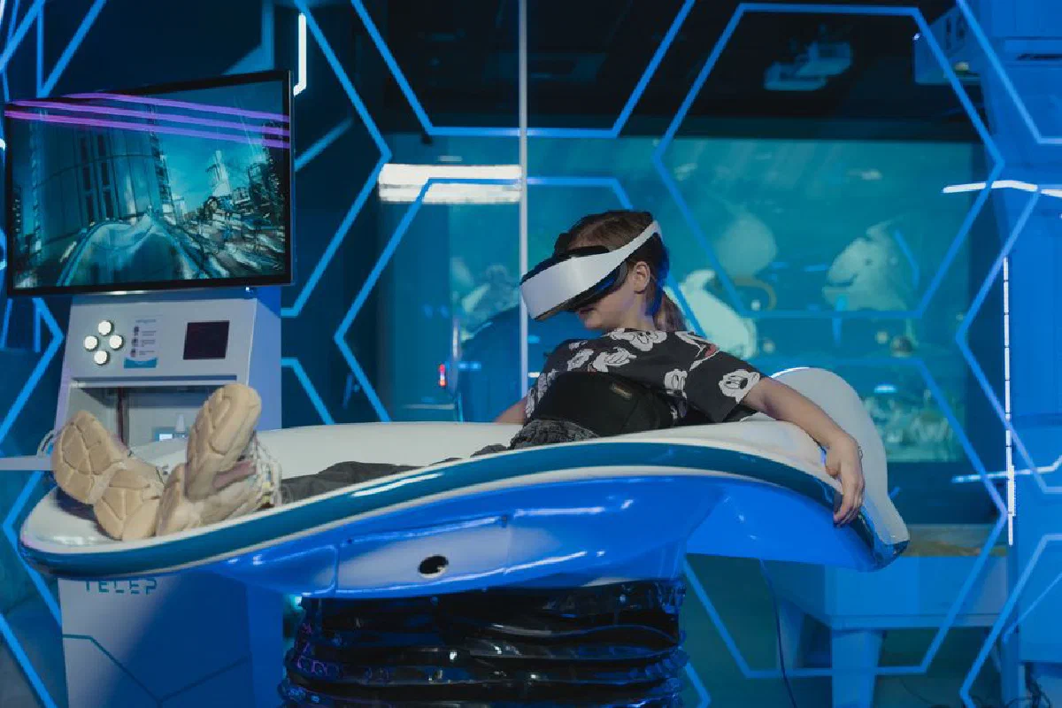 A girl enjoying an immersive VR ride in a futuristic gaming setup. High-tech entertainment at its best.
