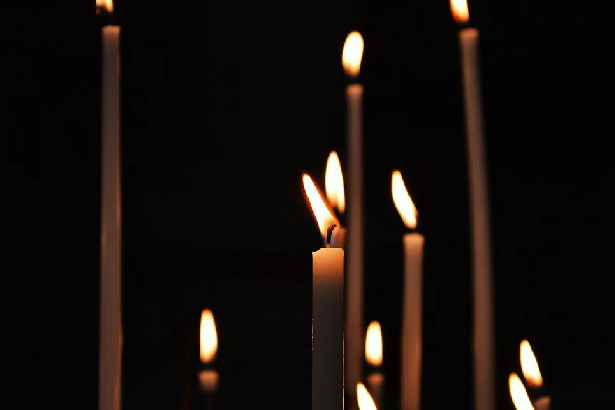Close-up of burning candles creating a warm, elegant ambiance.