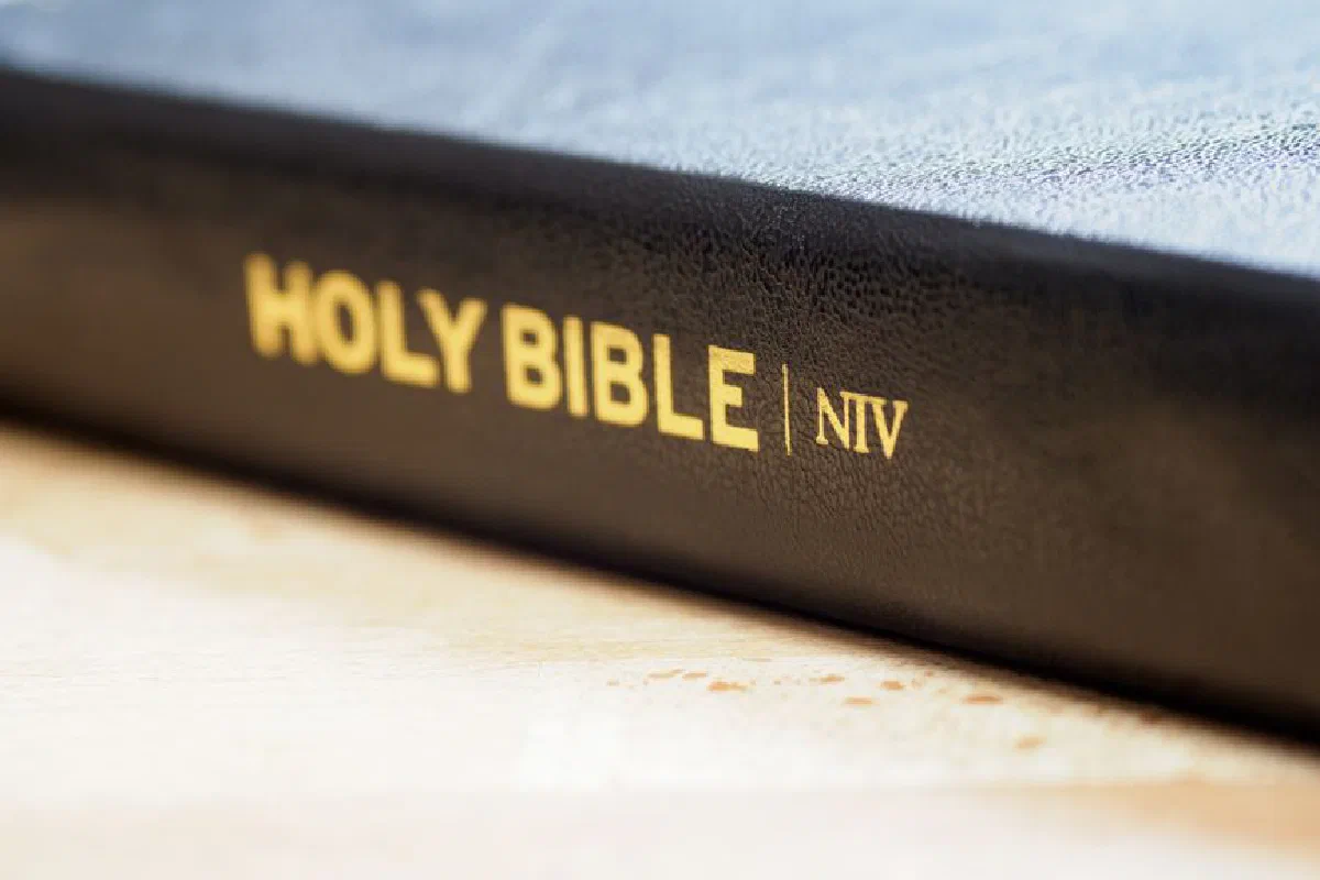 Macro image of the Holy Bible with selective focus on the title for a spiritual theme.