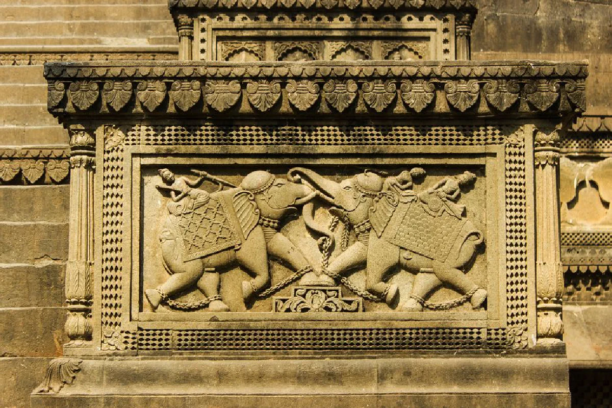 Detailed stone carving of elephants at Ahilya Fort, Maheshwar, India.