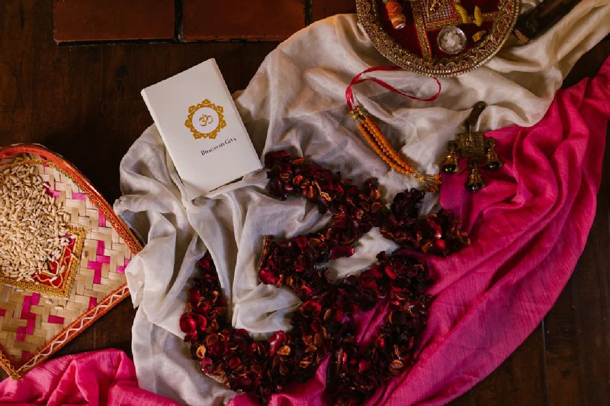 A vibrant still life featuring traditional Hindu items for Diwali celebration on colorful fabric.