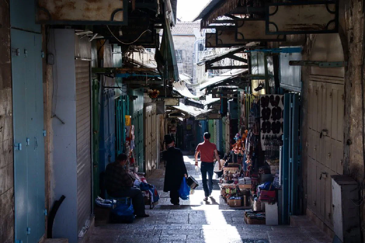A bustling alley filled with shops in the Old City of Jerusalem, Israel.