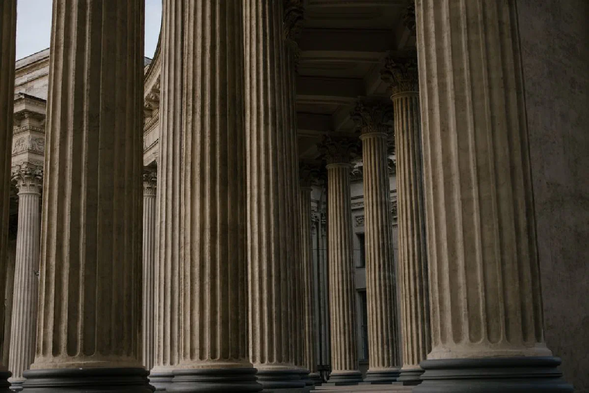 Ornate stone columns in a historic building showcasing classical architecture.
