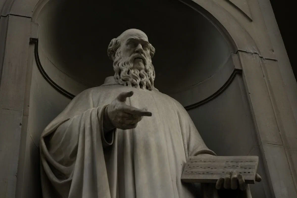 Historic marble statue of a bearded man holding a tablet.