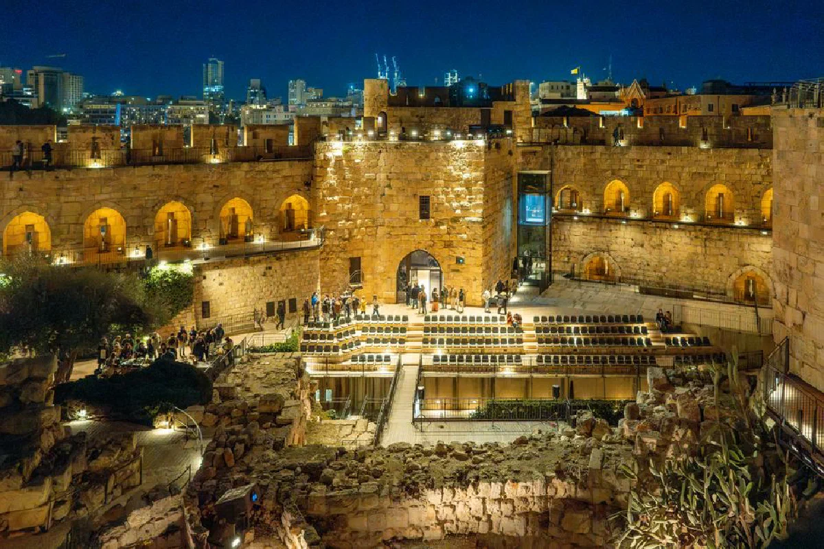 Stunning night photo of a historical site in Jerusalem illuminated by city lights.