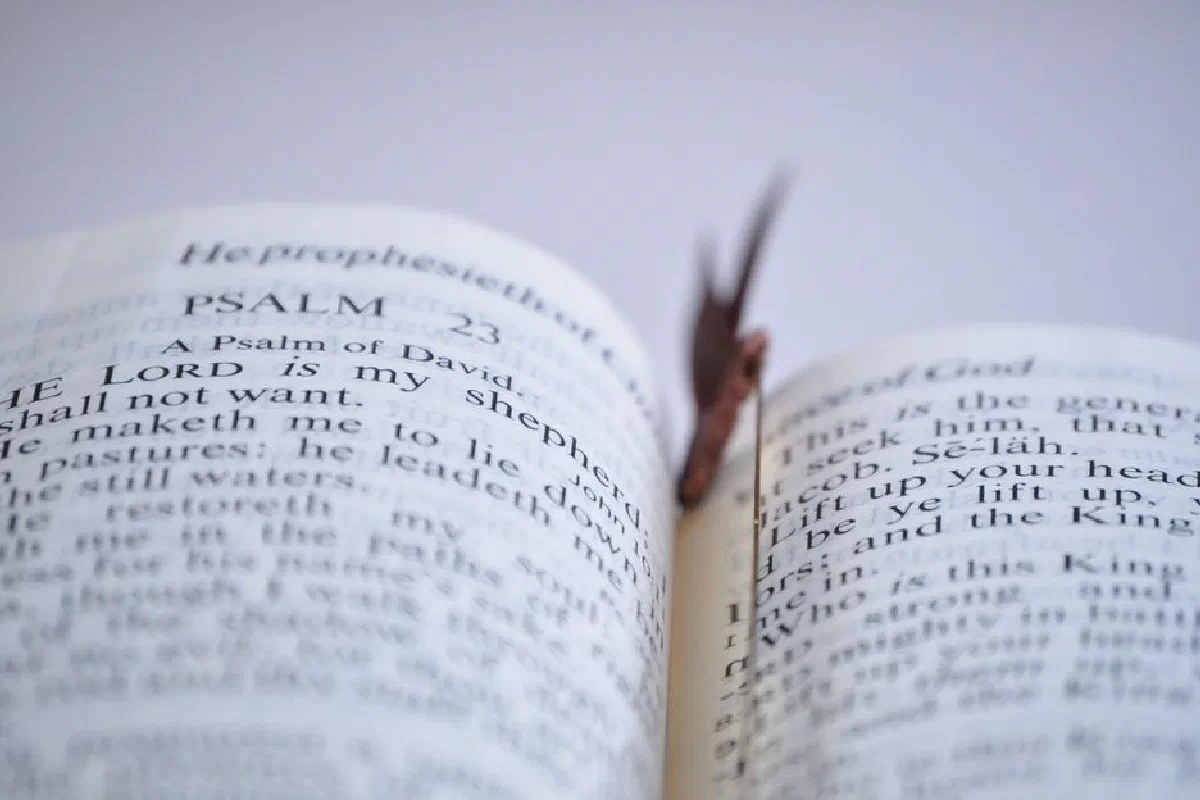Close-up image showing Psalm 23 in an open Bible with a bookmark.