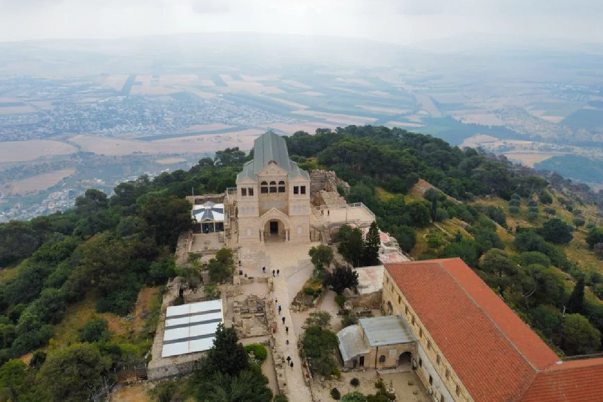Stunning aerial photo of the Church of the Transfiguration surrounded by lush landscapes on Mount Tabor, Israel.