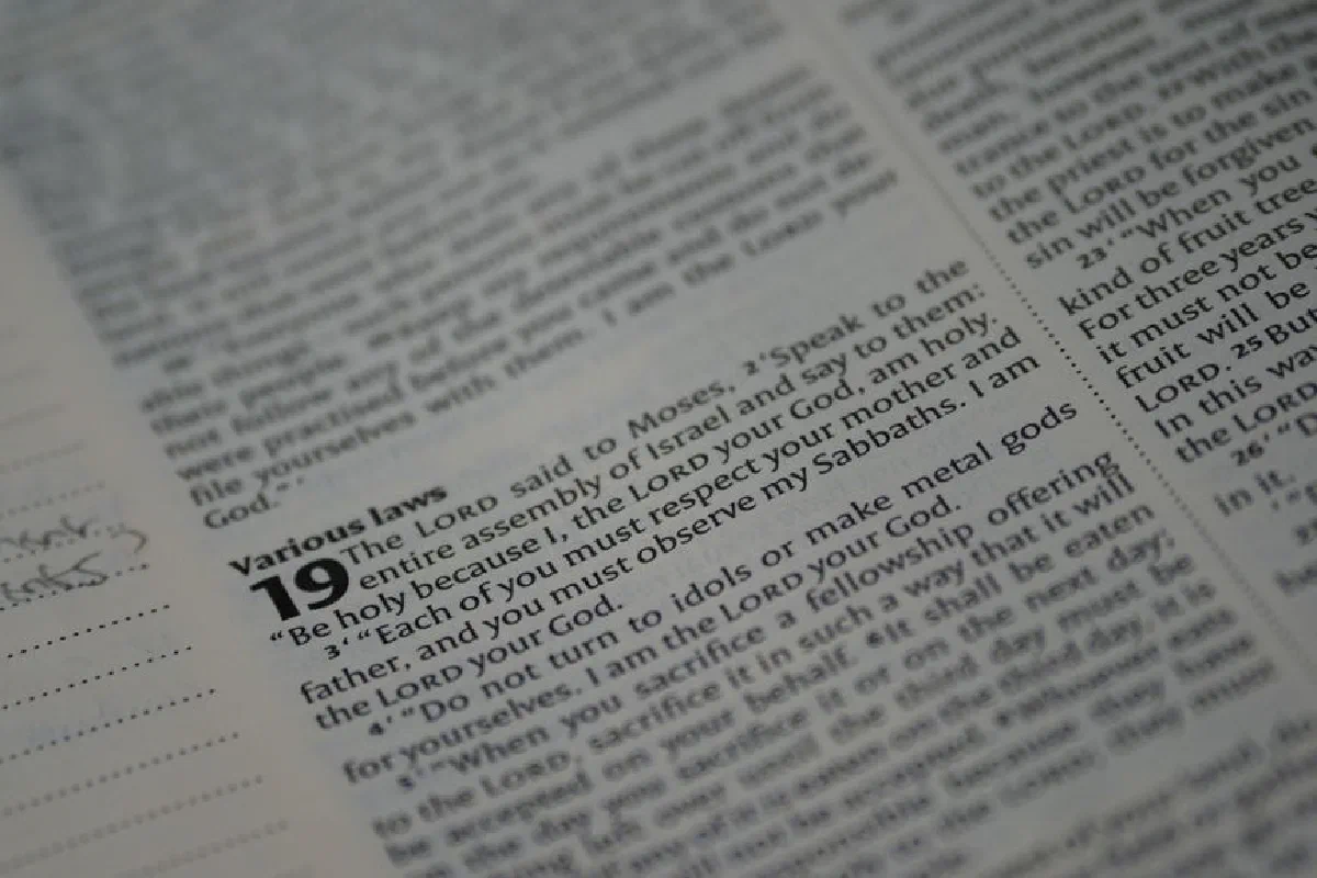 A detailed close-up of text from Leviticus in the Holy Bible, highlighting a passage about various laws.