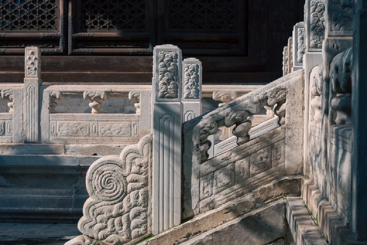 Ornate stone architectural details showcasing traditional craftsmanship at a historical temple.