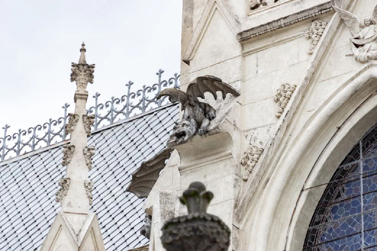 Detail of a gargoyle on the Basilica of the National Vow in Quito, showcasing neo-gothic architecture.