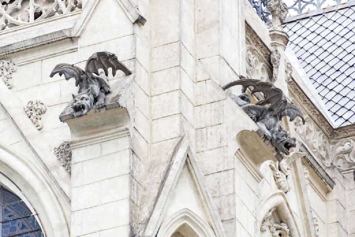 Neo-gothic architecture of Basilica del Voto Nacional in Quito, featuring intricate gargoyles.
