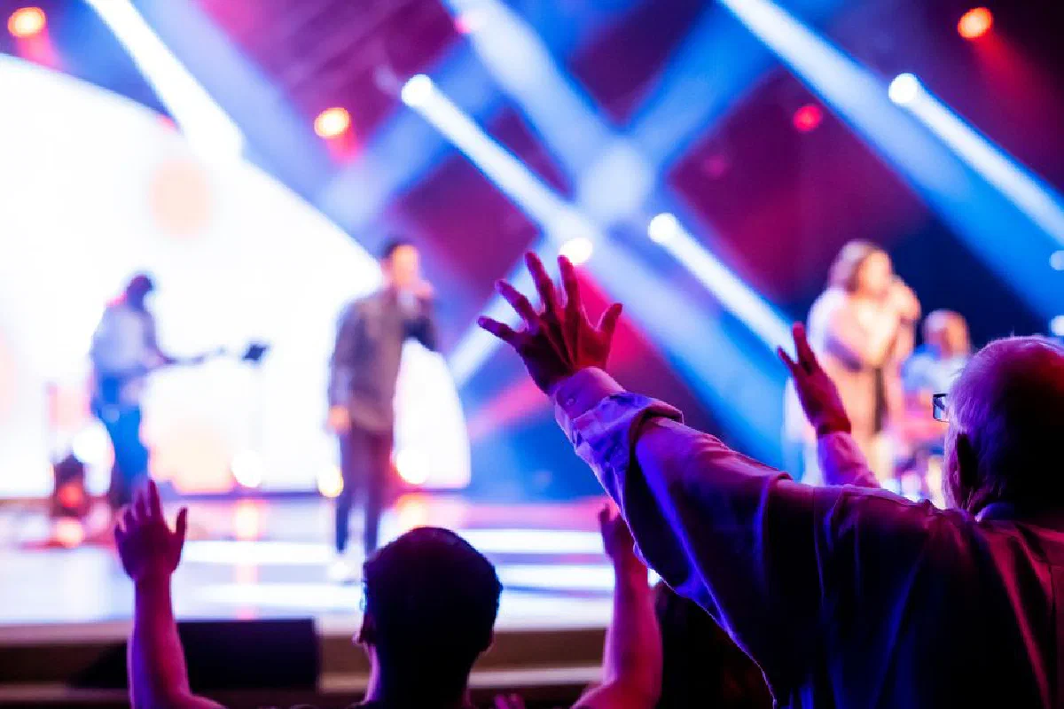 Vibrant and energetic live performance on stage with an engaged audience. Perfect for music and entertainment themes.