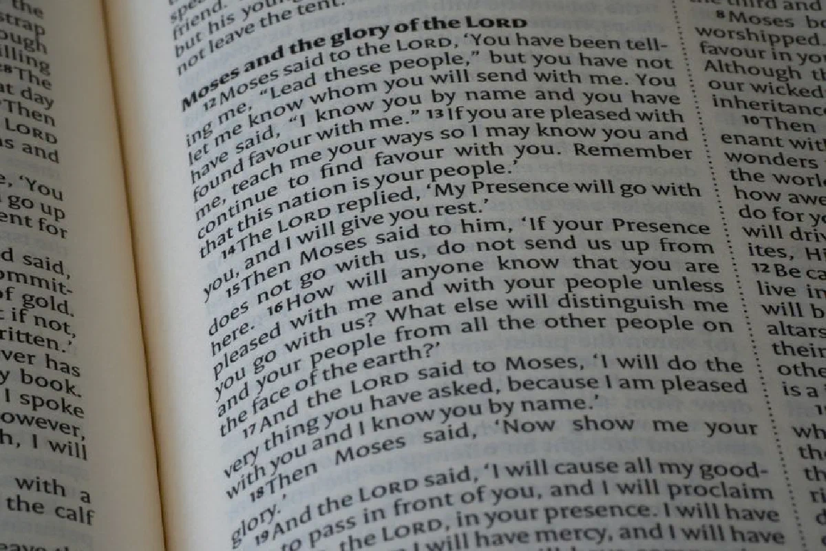 Close-up of an open Bible showing text from the book of Exodus, emphasizing scripture study and devotion.