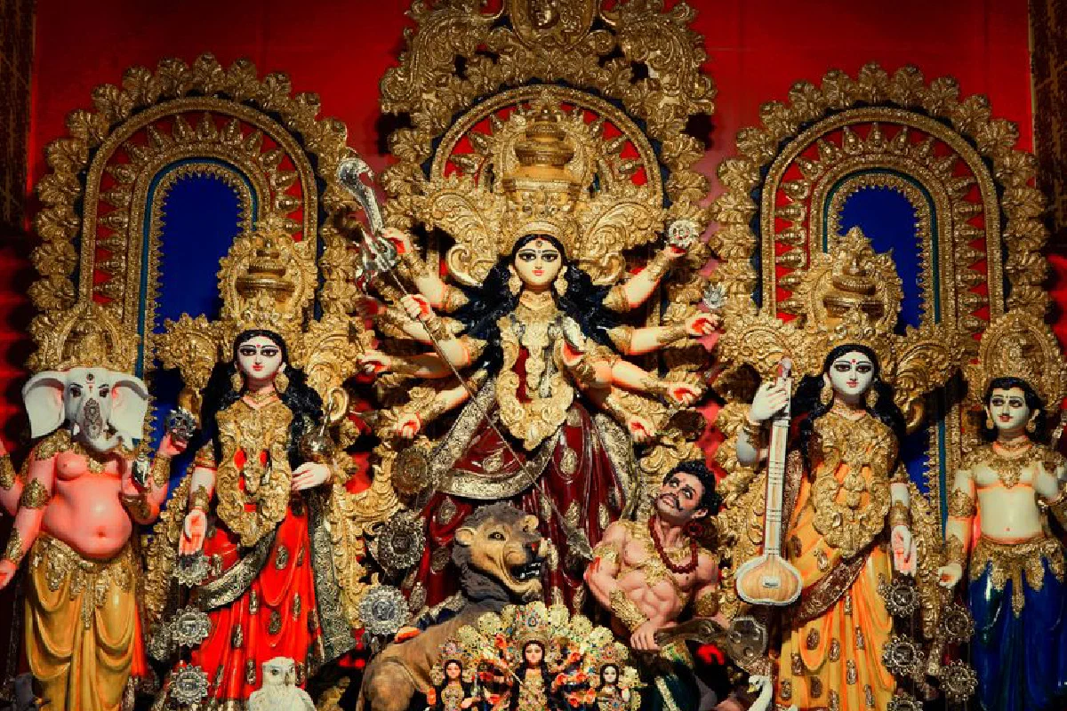 Colorful and ornate Durga Puja idol display during festival in Kolkata, India.