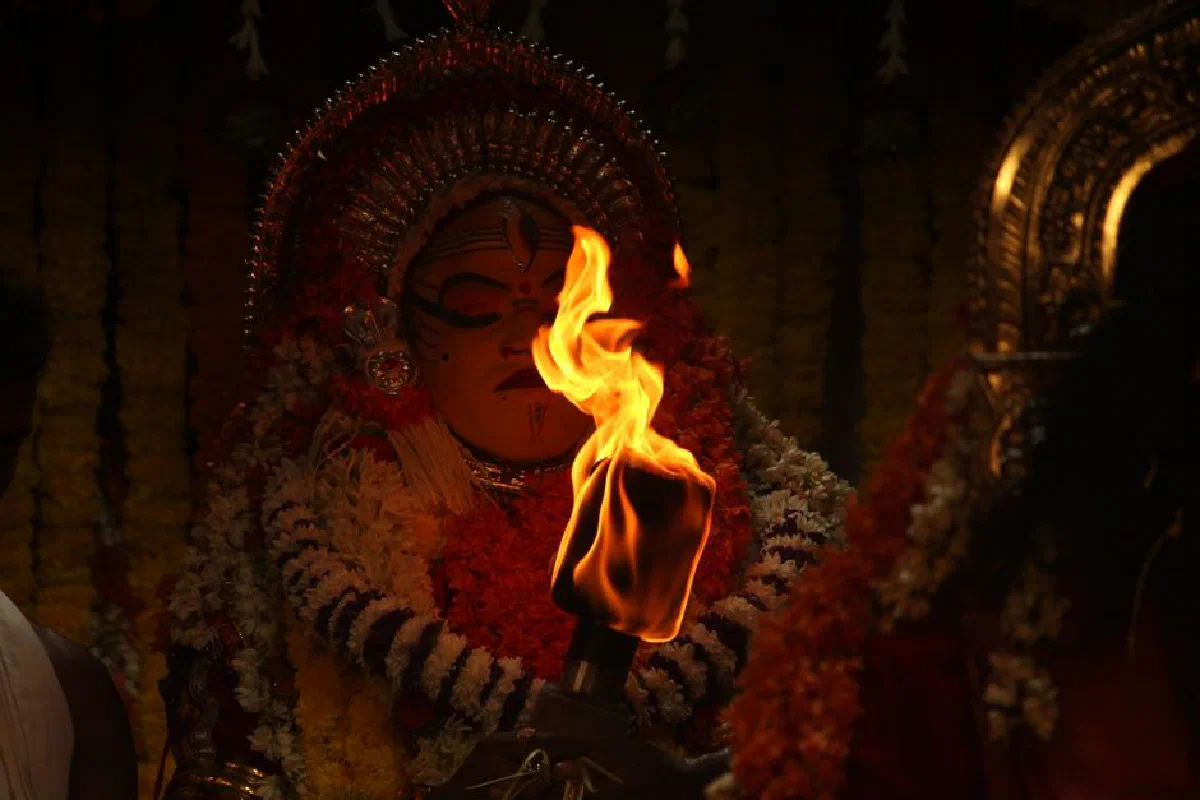 Dramatic scene of a traditional ritual with vibrant costume and fire.