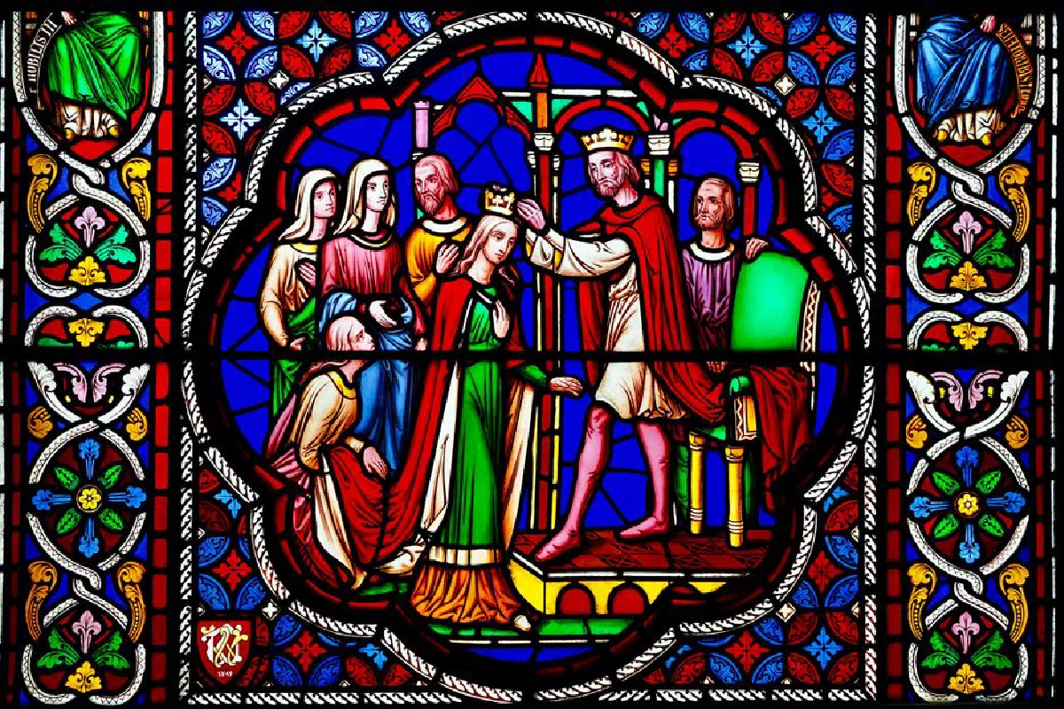 Vibrant stained glass artwork in an English cathedral showcasing a regal coronation with intricate designs.