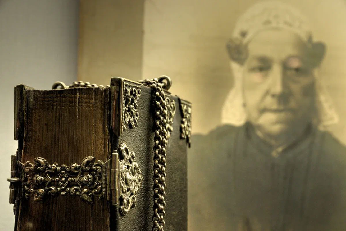 Close-up of a vintage leather-bound book with intricate metalwork, evoking a sense of history.
