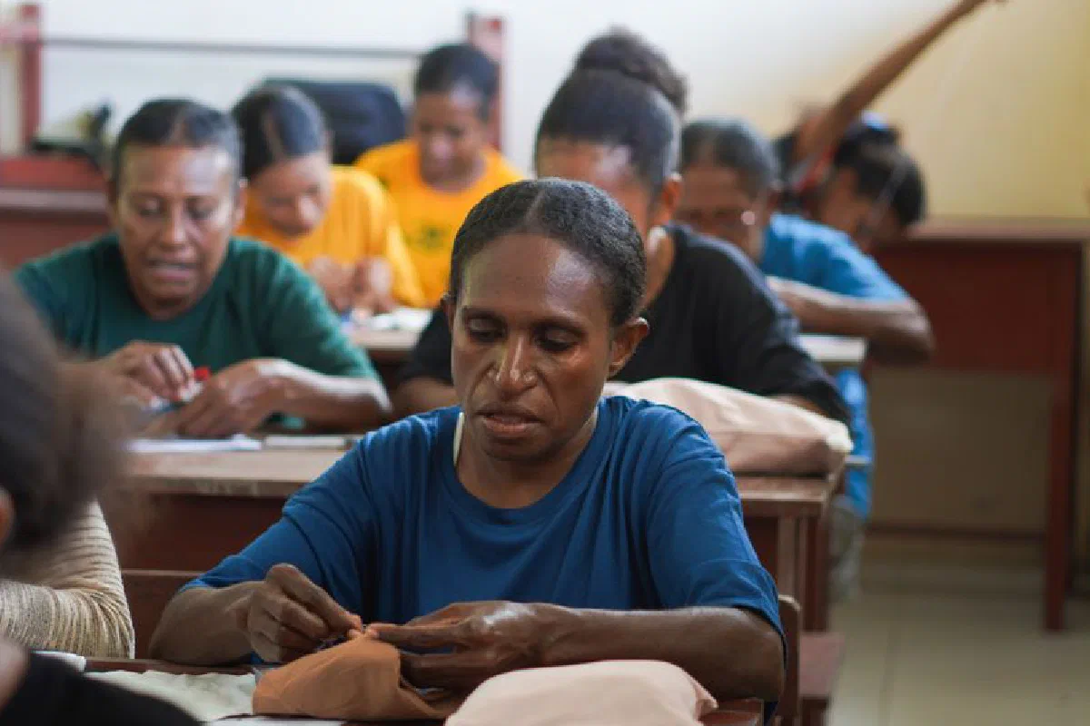 Indonesian women in Papua attending a sewing class for skill development.
