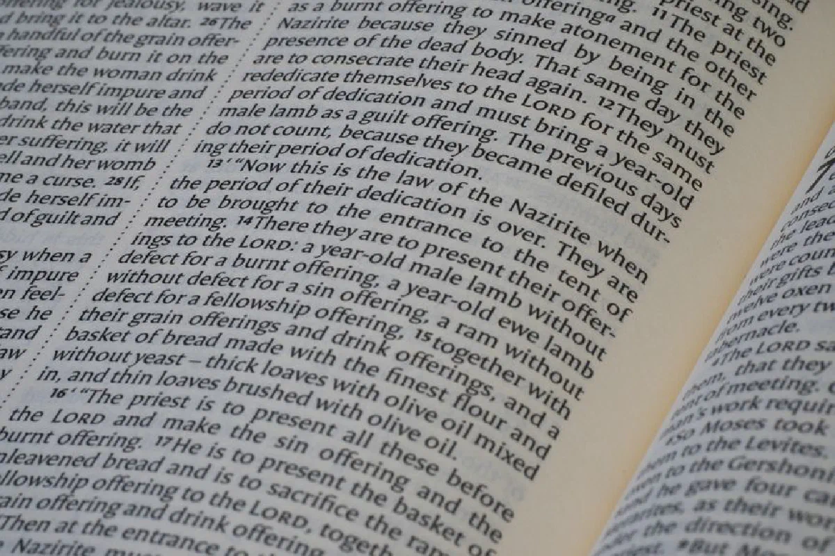 Detailed view of text from a religious book, emphasizing scripture study.