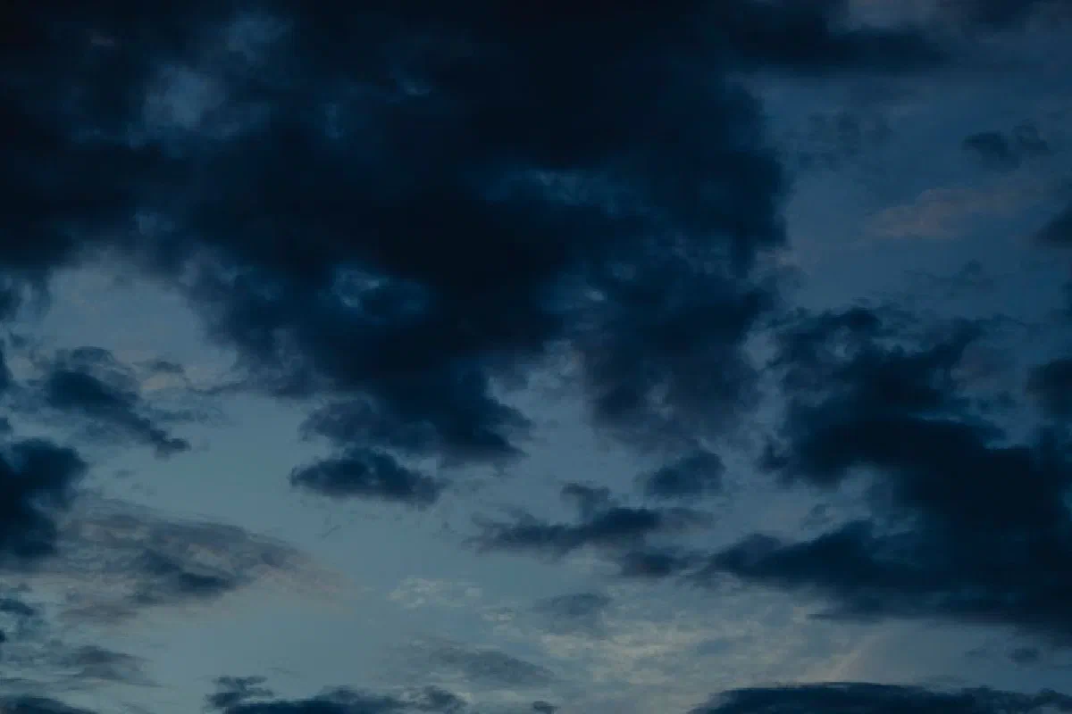 A moody and dramatic sky filled with dark clouds, creating an intense visual atmosphere.