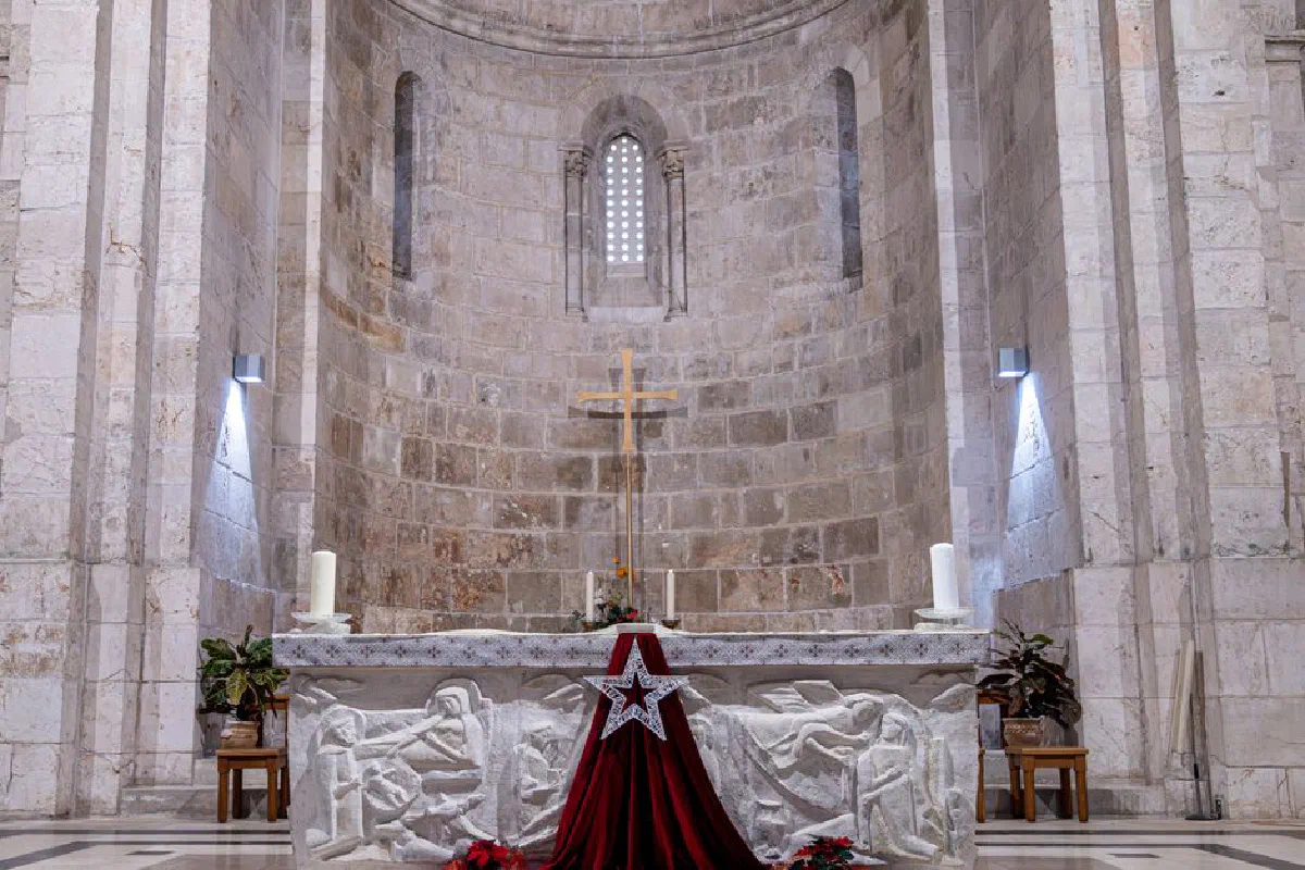 Beautiful church altar in Jerusalem with intricate carvings and a star decoration, capturing religious solemnity.