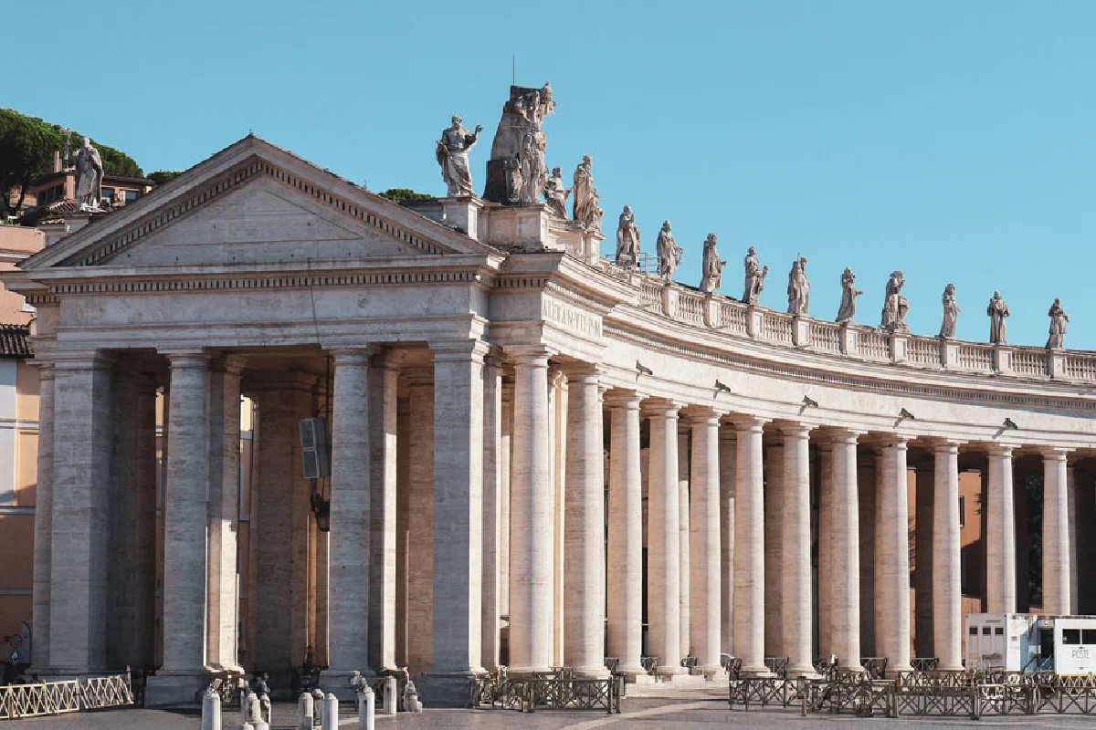 Magnificent architectural columns and statues in Vatican City's St. Peter's Square.