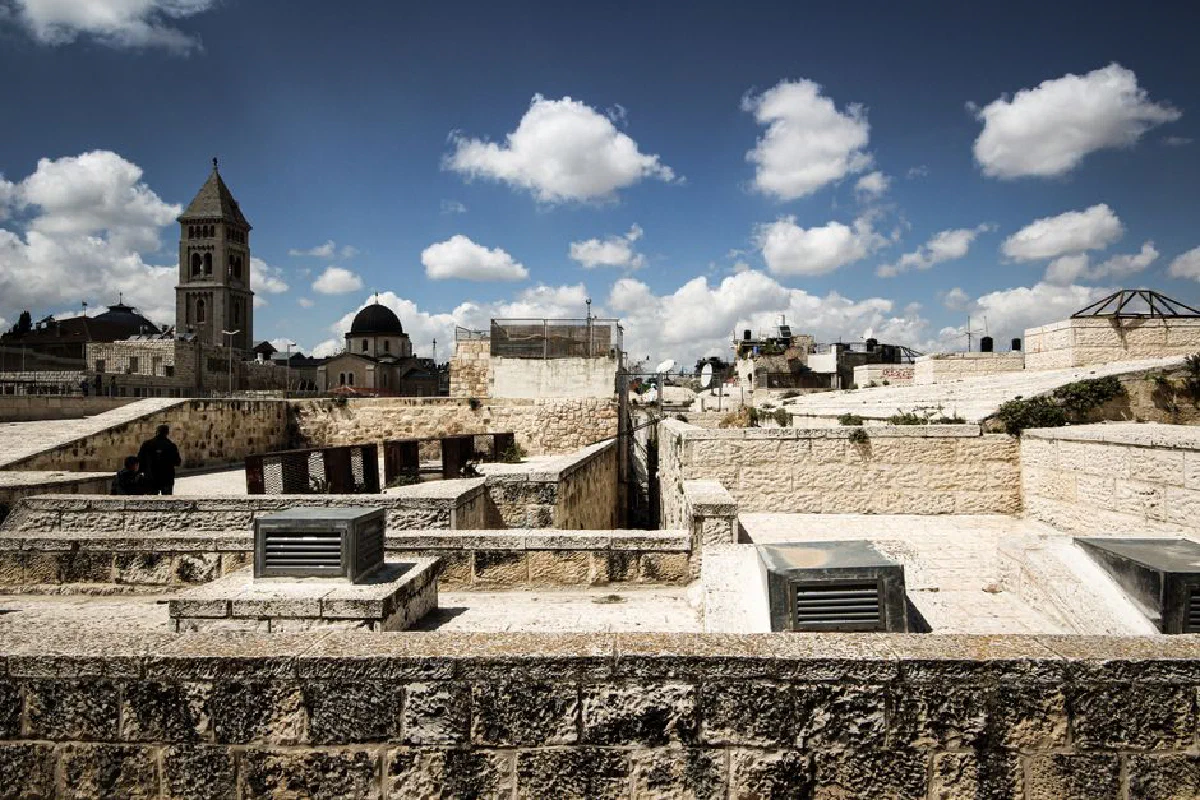 Explore the blend of ancient stone architecture and vibrant skyline in Jerusalem on a sunny day.