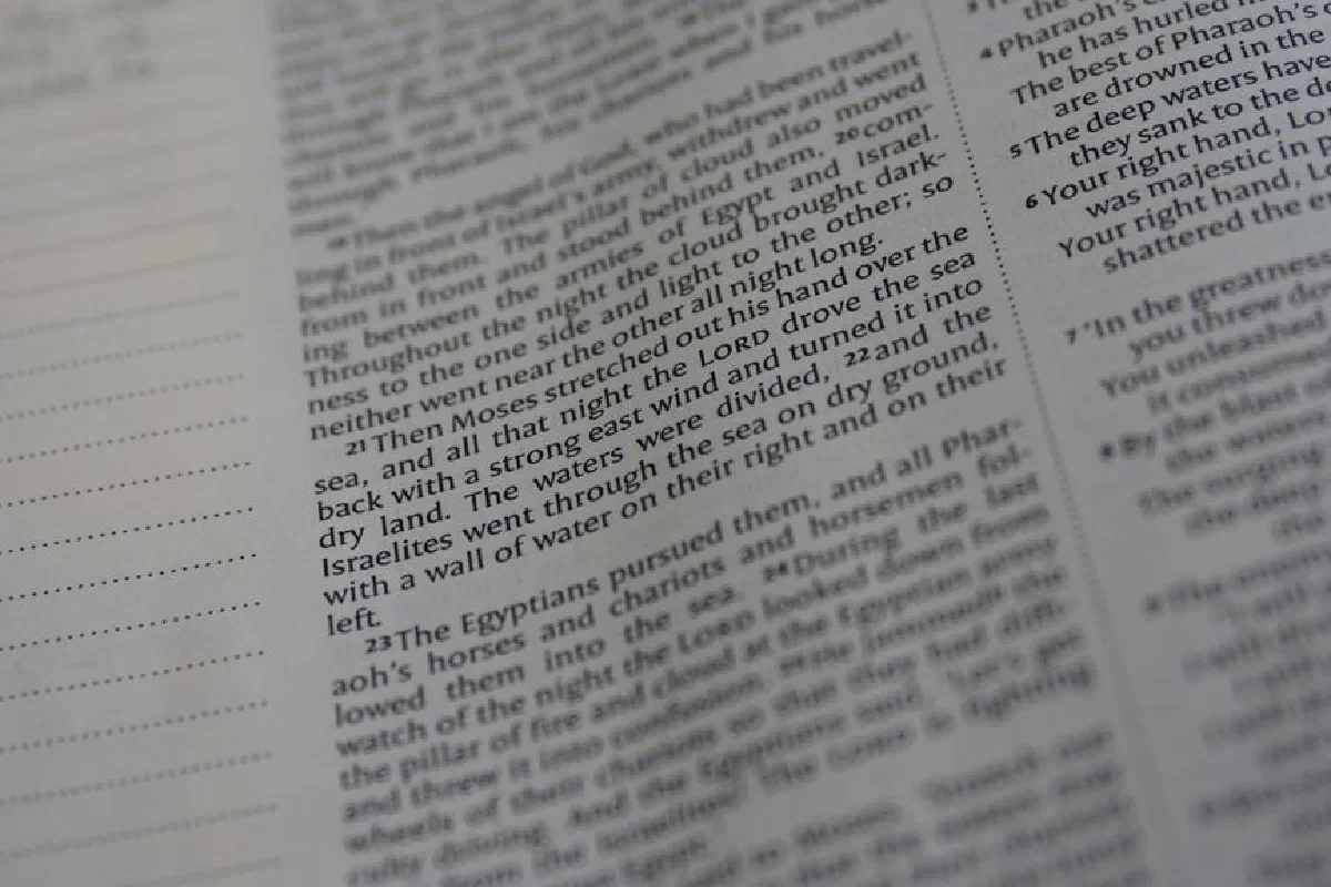 Selective focus image of an Old Testament scripture page from the Bible.