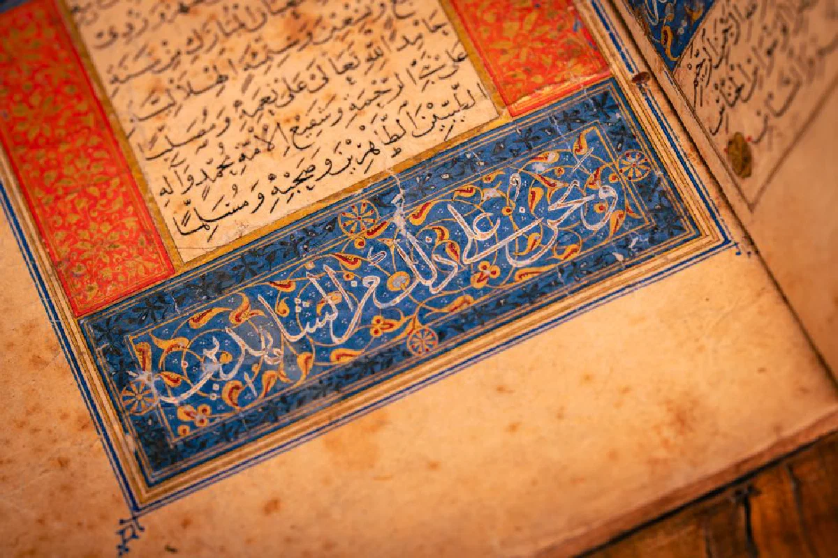 Intricate Arabic calligraphy on a vintage manuscript page with decorative border.