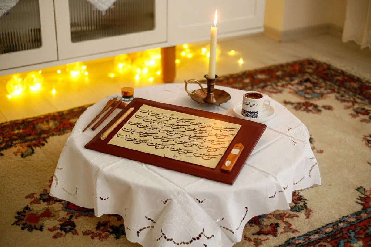 A warm indoor calligraphy scene with a candle, brushes, ink, and a decorative rug.