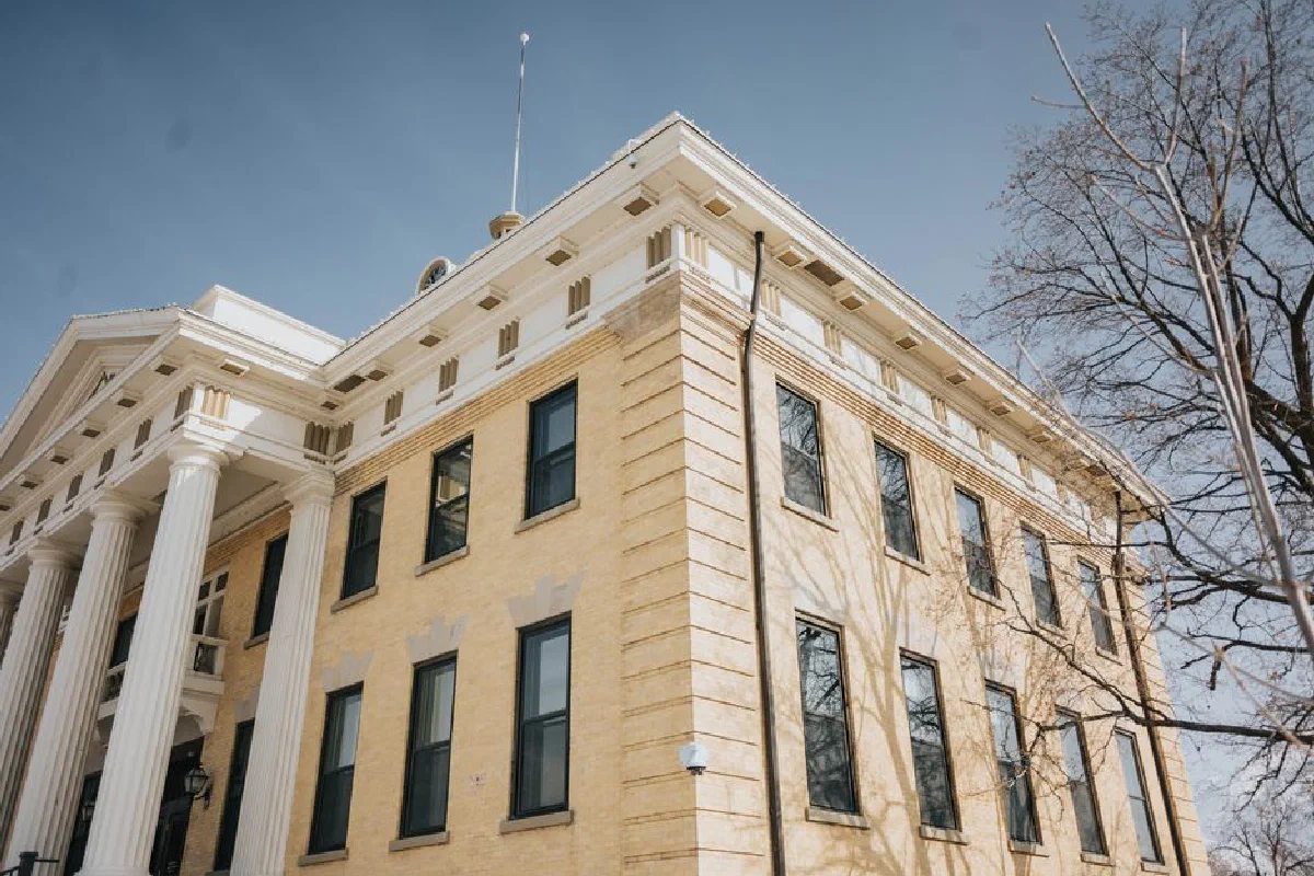 Low angle view of the historic Box Elder County Courthouse with columns and blue sky, Brigham City, Utah.