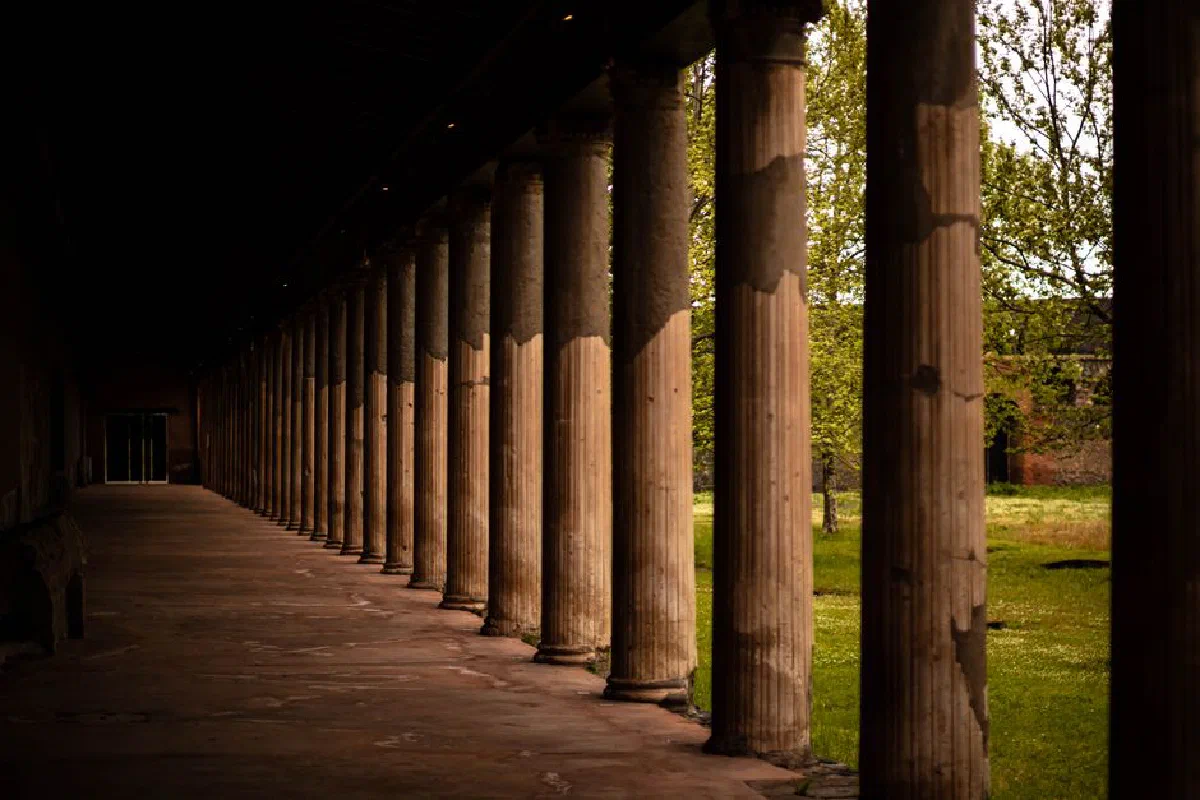 Elegant colonnade in ancient Pompeii, Italy, showcasing classical architecture.