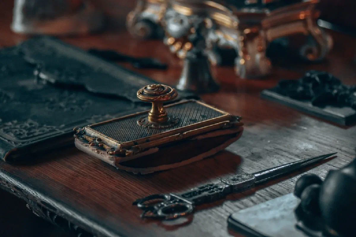 A close-up of a vintage desk with intricate antique objects, offering a nostalgic vibe.