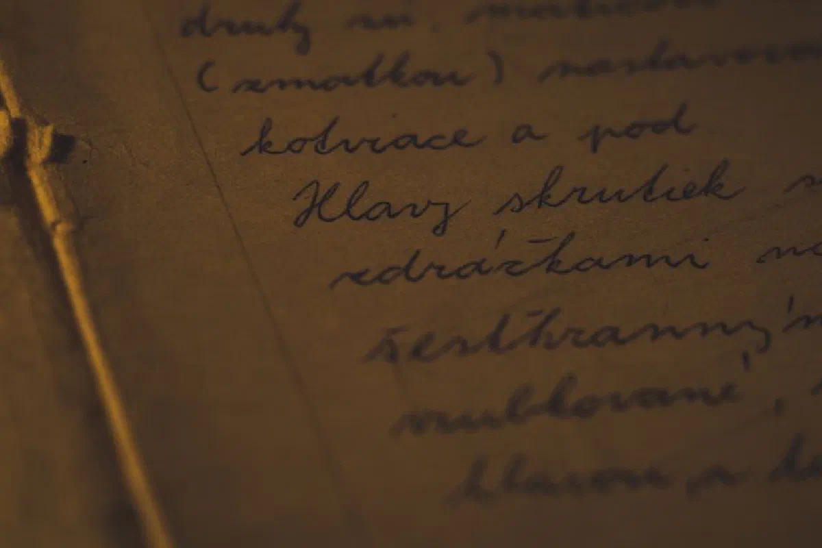 Detailed close-up of cursive handwriting on aged paper, evoking a nostalgic feel.