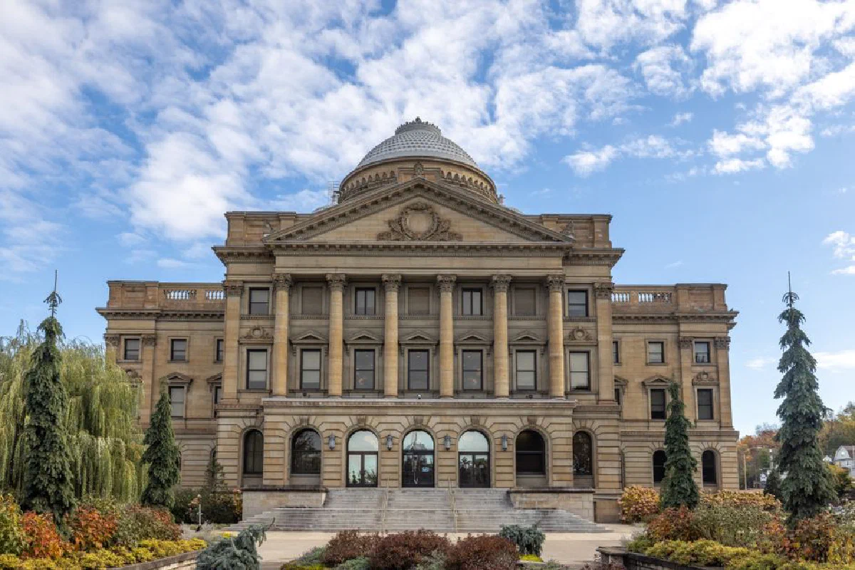 Front view of Luzerne County Courthouse, Wilkes-Barre, under a blue sky.