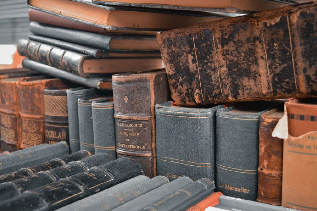 A detailed shot of antique leather-bound books stacked closely. Perfect for historical or literary themes.