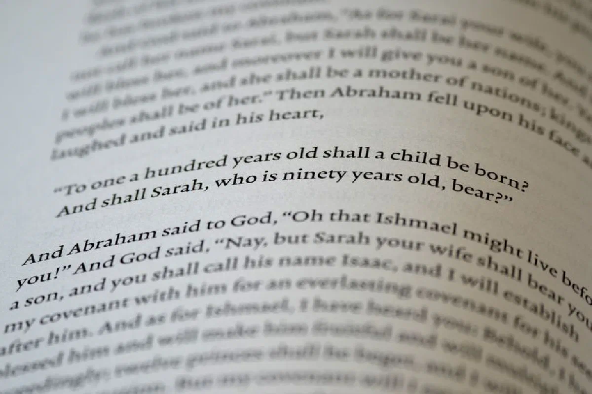 Close-up of text from the Book of Genesis in the Bible.