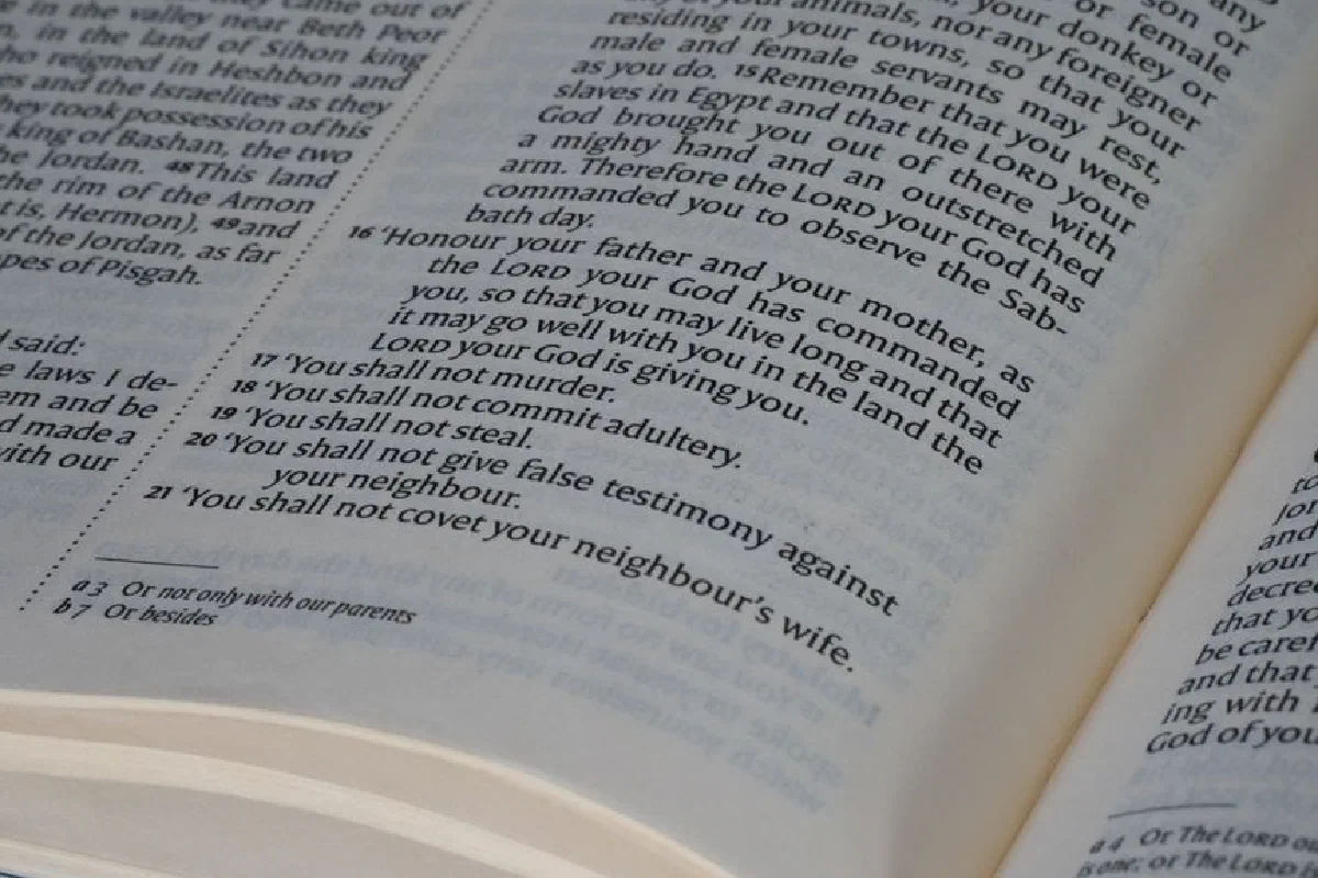 Detailed view of a Bible page showing the Ten Commandments text, ideal for religious and educational themes.
