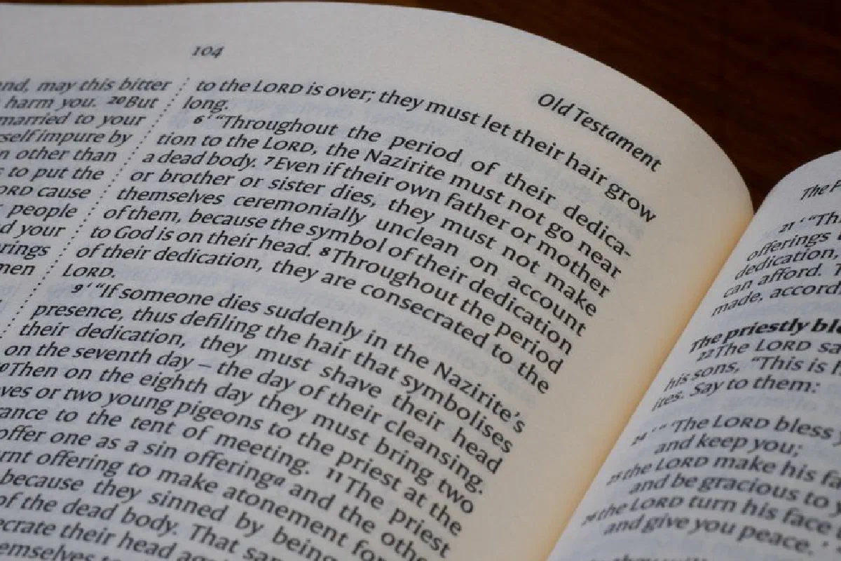 Detailed close-up of an open Bible displaying text from the Old Testament.