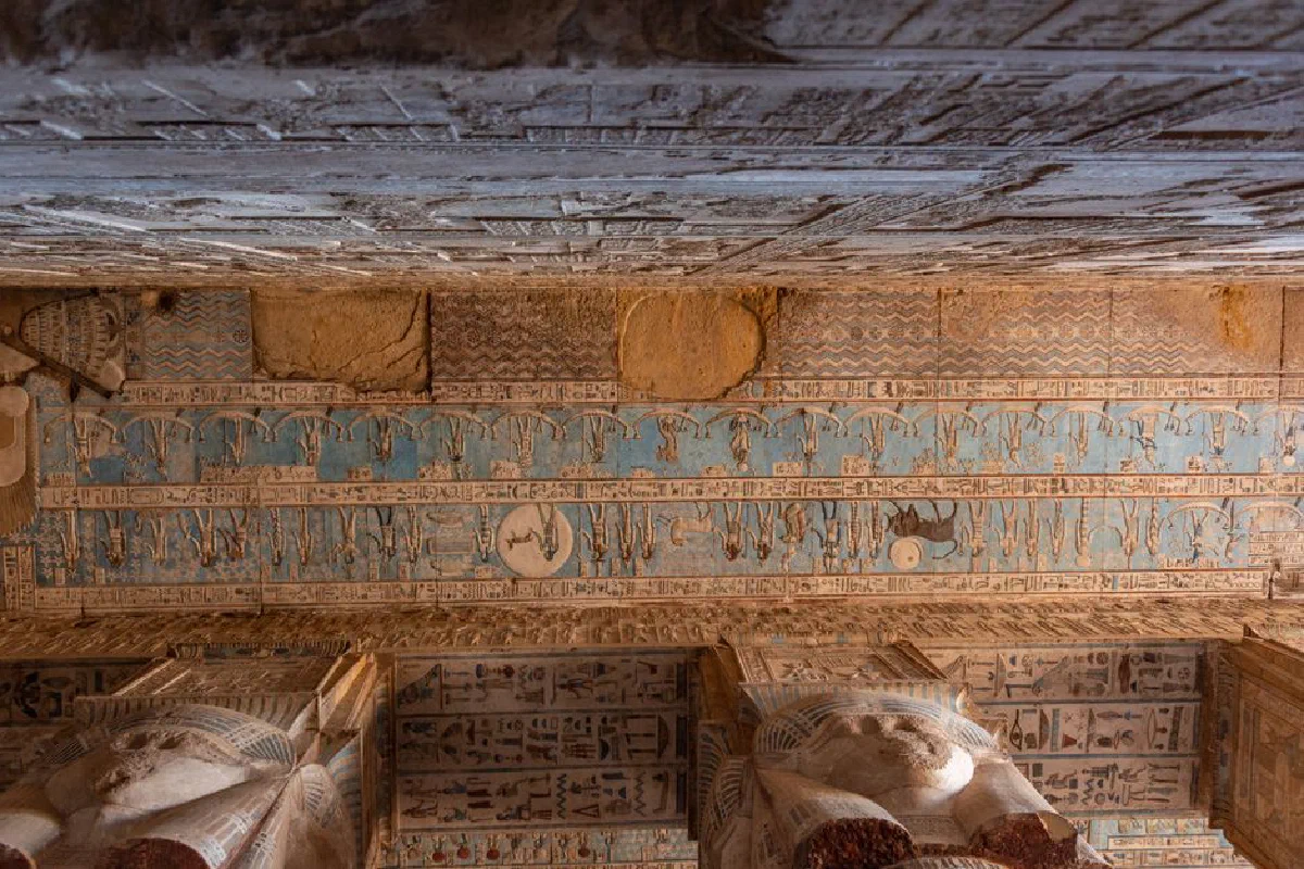 Intricate hieroglyphs adorn the ancient temple wall in Dendera, showcasing Egyptian culture.