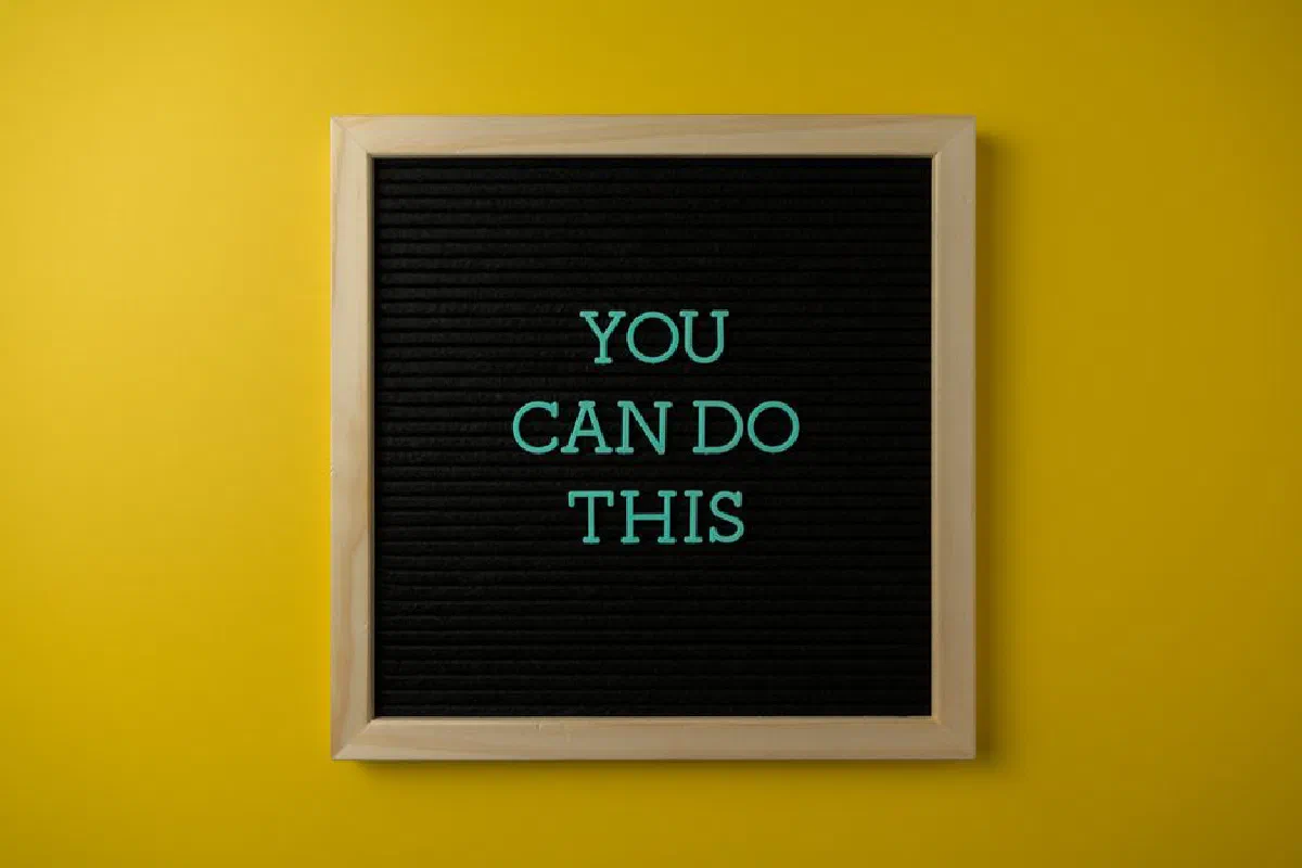 Inspirational message 'You Can Do This' displayed on a blackboard with a bold yellow backdrop.