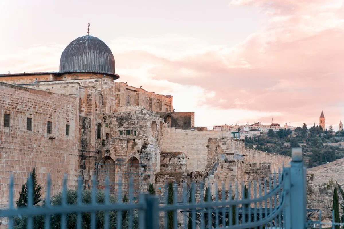 The historic Dome of Al-Aqsa Mosque captured at sunset, Jerusalem's timeless skyline.