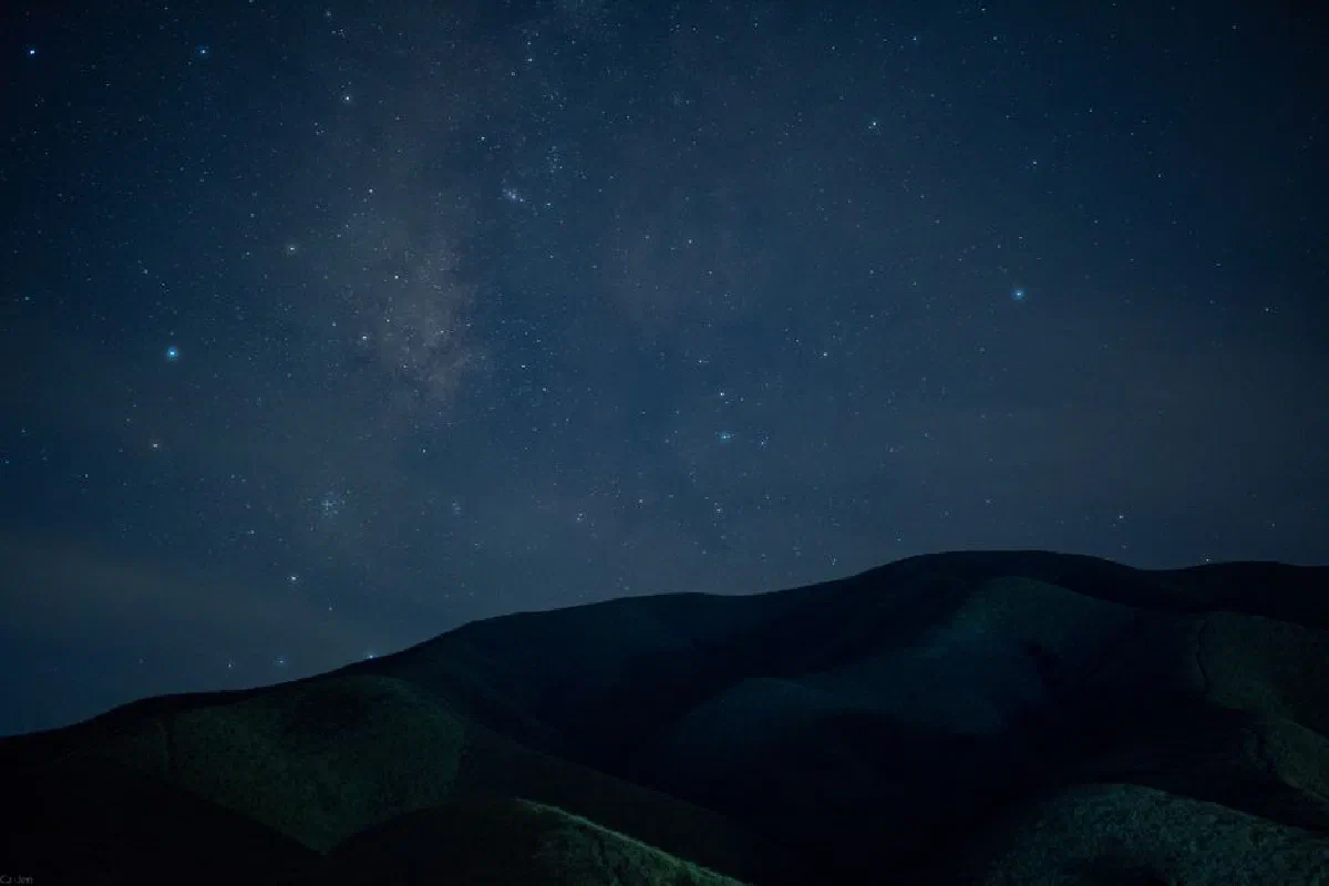 Captivating night sky with stars over mountains in Pingxiang, Jiangxi, China.