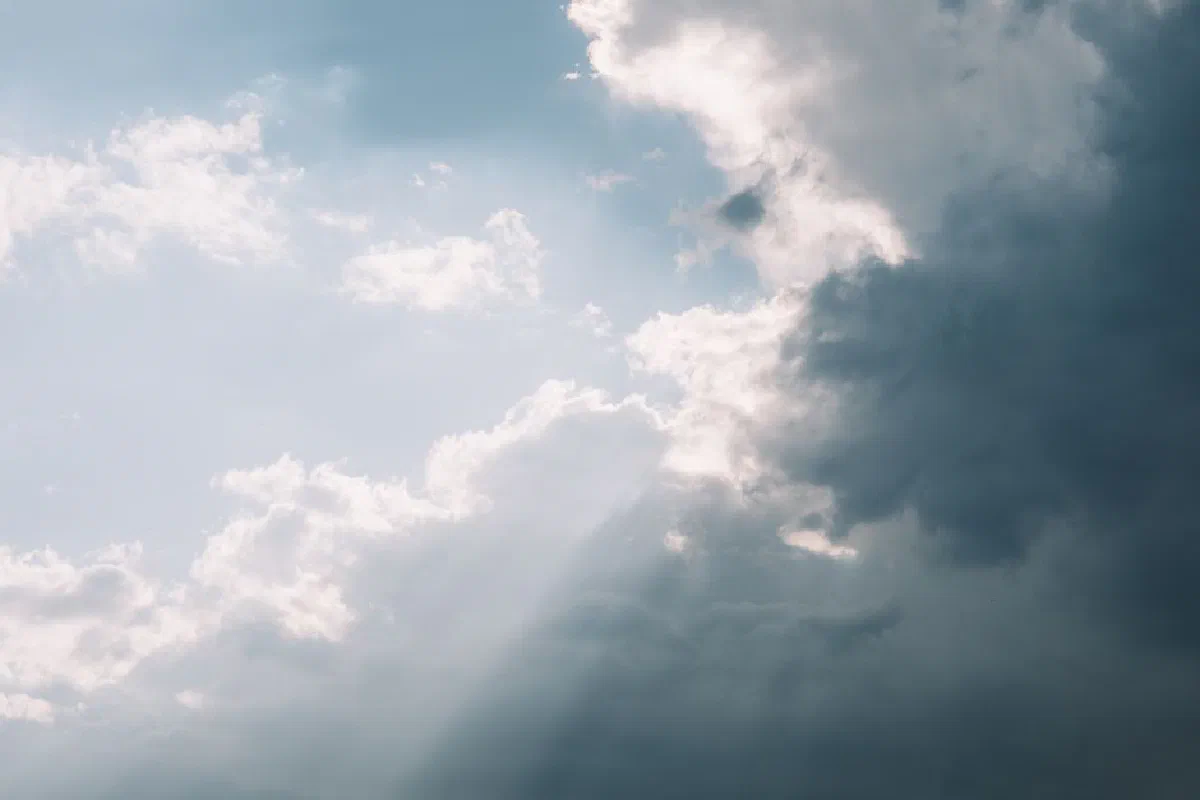 Captivating cloudscape with sunlight breaking through in Valencia, Spain. Ideal for weather enthusiasts.